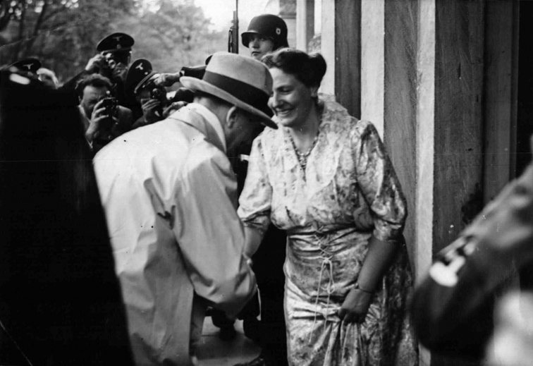 Adolf Hitler greets Winifred Wagner at his arrival for the Bayreuth festival